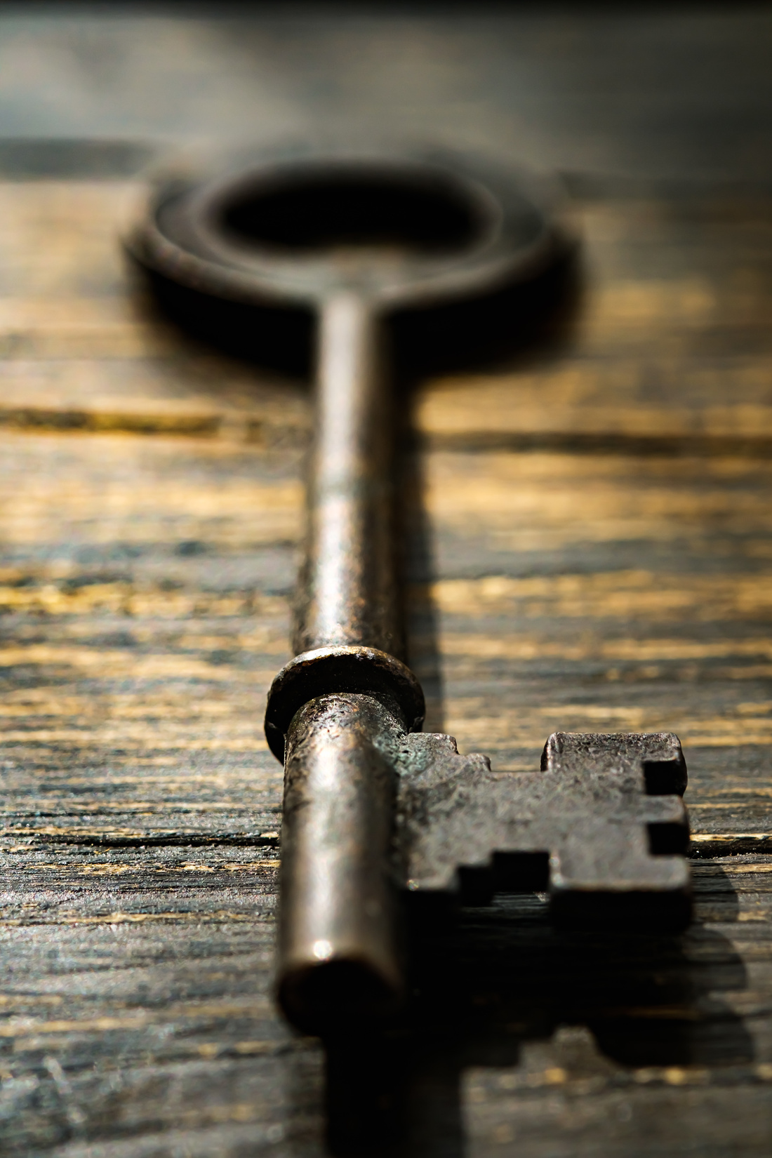 Vintage key on wooden table